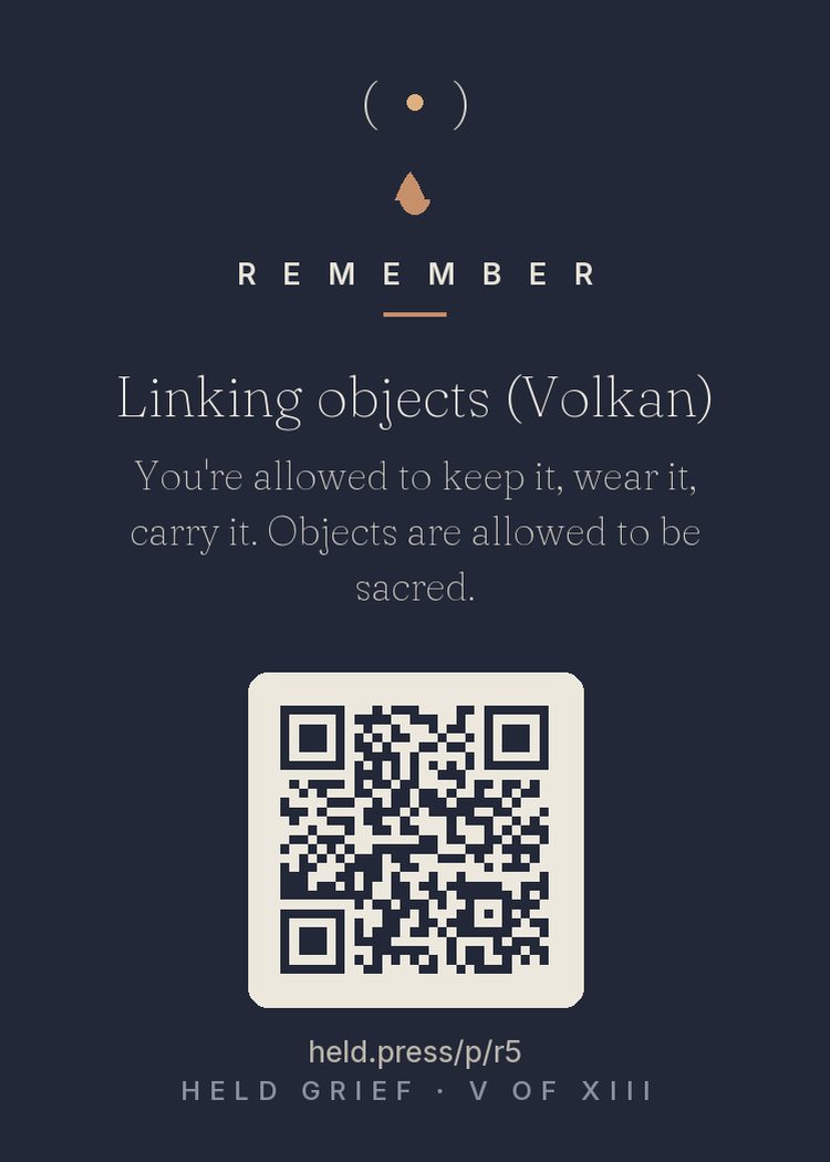 Objects are allowed to be sacred — kept things can become physical anchors for a continuing bond, worn, carried, touched when words fail. Pacing belongs entirely to the griever. A sweater can hold what a mind is still learning to carry.